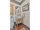 Powder room with marble sink and gold hardware at 375 Darren Dr, Fayetteville, GA 30215