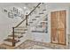 Cozy reading nook under the stairs with built in shelves and accent rug at 375 Darren Dr, Fayetteville, GA 30215