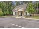 View of the community clubhouse with parking lot at 2004 Brittlebank Ln, Lawrenceville, GA 30043