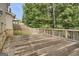 Spacious wooden deck for outdoor entertaining and relaxation with view of wooded backyard at 2004 Brittlebank Ln, Lawrenceville, GA 30043