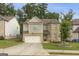 Charming two-story home with brick and siding, a well-maintained lawn, and an attached two-car garage at 2004 Brittlebank Ln, Lawrenceville, GA 30043