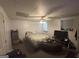 A spacious bedroom with a ceiling fan and a window letting in natural light at 2119 Amherst Se Trl, Conyers, GA 30094