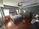 Spacious main bedroom featuring beautiful hardwood floors and a vaulted ceiling with a ceiling fan at 2119 Amherst Se Trl, Conyers, GA 30094