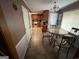 Eat-in kitchen with cherry cabinets, appliances, and a cozy dining area at 2119 Amherst Se Trl, Conyers, GA 30094