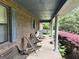 Relaxing front porch with seating area, perfect for enjoying the outdoors at 260 Willis Rd, Sharpsburg, GA 30277