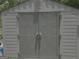 Close-up of the shed exterior featuring neutral colors and double door entry at 260 Willis Rd, Sharpsburg, GA 30277