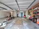 Large, functional garage interior with ample storage, tools, and potential parking space at 165 Cedar Ridge Rd, Locust Grove, GA 30248