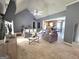 Comfortable living room with vaulted ceiling, open to kitchen and dining, creating a welcoming and airy atmosphere at 165 Cedar Ridge Rd, Locust Grove, GA 30248