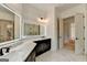 Bathroom featuring double vanity, a view of the shower and tub at 4090 Sandy Lake Dr, Lithonia, GA 30038