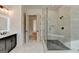Open bathroom layout showcasing the shower and vanity at 4090 Sandy Lake Dr, Lithonia, GA 30038