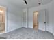 Comfortable bedroom offers neutral carpet, bright white walls, and modern ceiling fan at 4090 Sandy Lake Dr, Lithonia, GA 30038