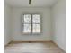 Bright bedroom with hardwood flooring and a large window providing lots of natural light at 4090 Sandy Lake Dr, Lithonia, GA 30038
