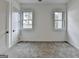 Cozy bedroom with gray carpet, white walls, and natural light from two windows at 4090 Sandy Lake Dr, Lithonia, GA 30038