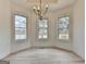 Bright dining area showcasing views of the outdoors and a modern chandelier at 4090 Sandy Lake Dr, Lithonia, GA 30038