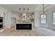 Modern kitchen featuring an island, pendant lighting, white cabinets, and stainless appliances at 4090 Sandy Lake Dr, Lithonia, GA 30038