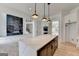 Bright and open kitchen with modern finishes, stainless steel appliances, and island flowing into living space at 4090 Sandy Lake Dr, Lithonia, GA 30038