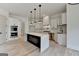 Bright kitchen features a large island with marble countertop, stainless steel appliances, and white cabinetry at 4090 Sandy Lake Dr, Lithonia, GA 30038