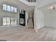 Open-concept living space featuring wood floors, high ceilings, and a glass sliding door to a patio at 4090 Sandy Lake Dr, Lithonia, GA 30038