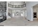 Spacious living room with a fireplace, access to the kitchen and views of the upper level at 4090 Sandy Lake Dr, Lithonia, GA 30038
