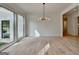 Bright living room with light wood floors, an open floor plan, and natural light at 4090 Sandy Lake Dr, Lithonia, GA 30038