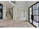 Light-filled living room with wood floors, high ceilings, a staircase, and modern lighting fixtures at 4090 Sandy Lake Dr, Lithonia, GA 30038