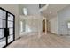 Bright, airy living room with soaring ceilings and light wood floors shows an open floor plan at 4090 Sandy Lake Dr, Lithonia, GA 30038