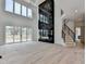 Stunning living area with fireplace, stairs and high ceilings offers a grand and modern space at 4090 Sandy Lake Dr, Lithonia, GA 30038