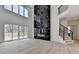 Expansive living room with high ceilings, fireplace, and sliding doors, offers modern elegance at 4090 Sandy Lake Dr, Lithonia, GA 30038