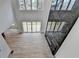 Bright living room boasts hardwood floors, large windows, and a modern fireplace at 4090 Sandy Lake Dr, Lithonia, GA 30038