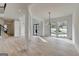 Bright open-concept living room featuring hardwood floors and large windows providing lots of natural light at 4090 Sandy Lake Dr, Lithonia, GA 30038