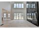 Stunning living space boasting fireplace, deck access, and light-filled windows creates an inviting atmosphere at 4090 Sandy Lake Dr, Lithonia, GA 30038