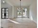Bright living room with light wood floors and access to the front yard provides plenty of light at 4090 Sandy Lake Dr, Lithonia, GA 30038