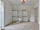 Bright walk-in closet featuring custom shelving, and a view of the backyard at 4090 Sandy Lake Dr, Lithonia, GA 30038