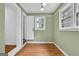 Cozy bedroom featuring hardwood floors, a window, and neutral paint at 1042 Faith Se Ave, Atlanta, GA 30316