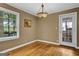 Cozy dining area featuring hardwood floors, a stylish light fixture, and natural light at 1042 Faith Se Ave, Atlanta, GA 30316