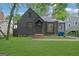 Charming single-Gathering home featuring a well-manicured lawn and a classic exterior design at 1042 Faith Se Ave, Atlanta, GA 30316