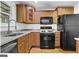 Functional kitchen featuring light wood cabinets and modern appliances at 1042 Faith Se Ave, Atlanta, GA 30316