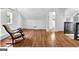 Living room with a rocking chair, hardwood flooring, and natural light from windows at 1042 Faith Se Ave, Atlanta, GA 30316
