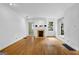 Bright living room with hardwood floors, fireplace, and ample natural light from large windows at 1042 Faith Se Ave, Atlanta, GA 30316