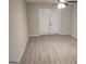 Bedroom with new flooring and sliding glass doors leading to the outdoors at 17 Brittany Ne Way, Atlanta, GA 30324