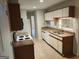 Efficient kitchen layout with essential appliances, granite countertops, and bright cabinets at 17 Brittany Ne Way, Atlanta, GA 30324