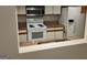 Functional kitchen features a full suite of appliances, granite countertops, and ample cabinet space at 17 Brittany Ne Way, Atlanta, GA 30324