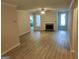 Spacious living room featuring new flooring, fireplace, and ample natural light at 17 Brittany Ne Way, Atlanta, GA 30324