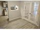 Inviting living room with light wood flooring and french doors at 17 Brittany Ne Way, Atlanta, GA 30324