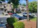 Parking lot with several vehicles, surrounded by trees and shrubs at 17 Brittany Ne Way, Atlanta, GA 30324