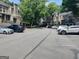 Parking lot filled with many vehicles and surrounded by trees at 17 Brittany Ne Way, Atlanta, GA 30324