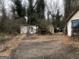 Property featuring a white shed and a spacious yard at 702 Emily Nw Pl # 0, Atlanta, GA 30318