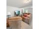 Large finished basement has comfortable seating, great lighting, and a mounted television at 120 Hawken Trl, Mcdonough, GA 30253
