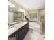 Bathroom featuring a soaking tub, walk-in shower and double sink granite countertop vanity at 120 Hawken Trl, Mcdonough, GA 30253
