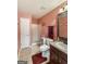Bathroom featuring a vanity with a sink, a toilet, and a glass-enclosed shower with a neutral tile floor at 120 Hawken Trl, Mcdonough, GA 30253